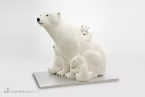 Mother polar bear and cubs