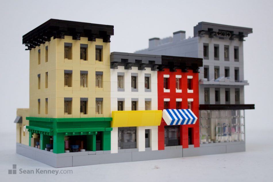 Little-city-shops LEGO art by Sean Kenney