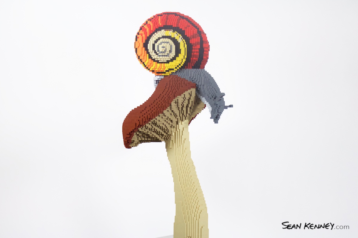 Snail-on-mushroom LEGO art by Sean Kenney